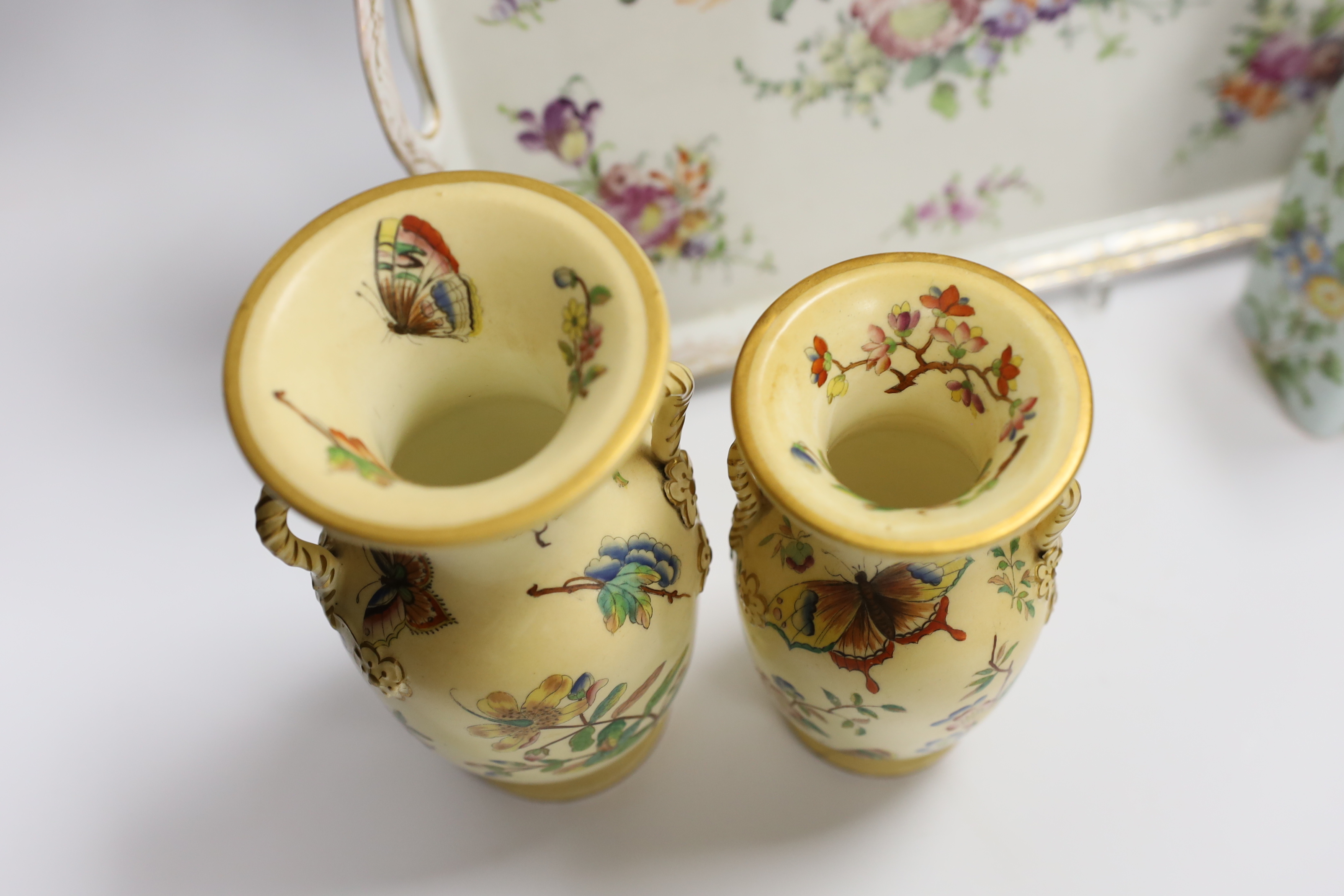 A Dresden porcelain floral dish, Cantagalli caddy and three Paris vases, largest 33cm wide